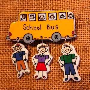 School Bus Brooch with 3 kids hanging down. Pin